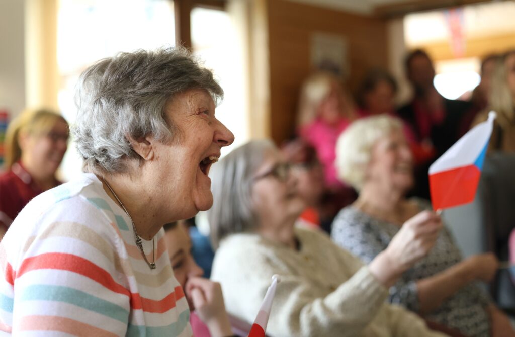 Double the difference donation impact - elderly woman laughing 